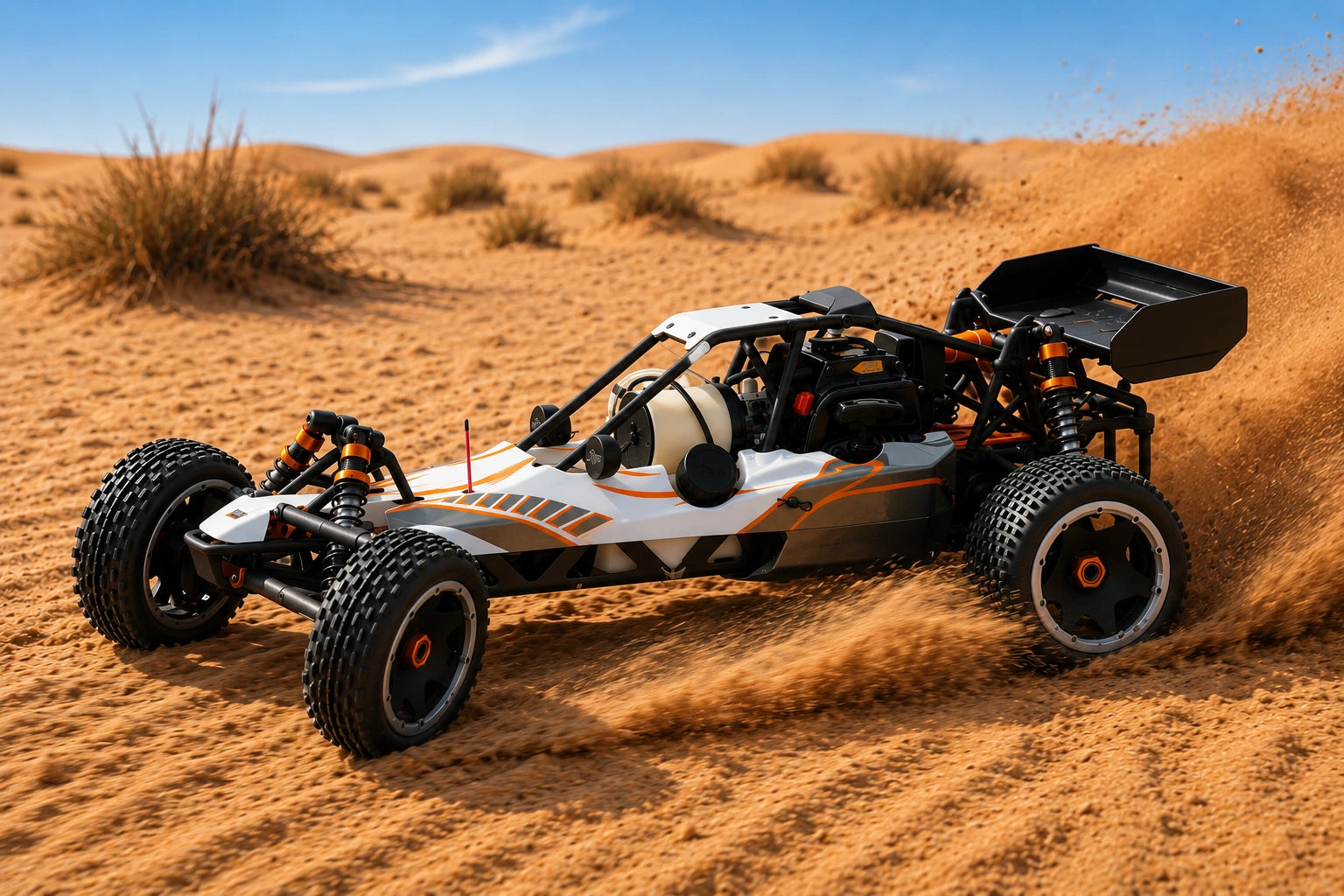 RC buggy Baja 1/5 driving through desert sand dunes.